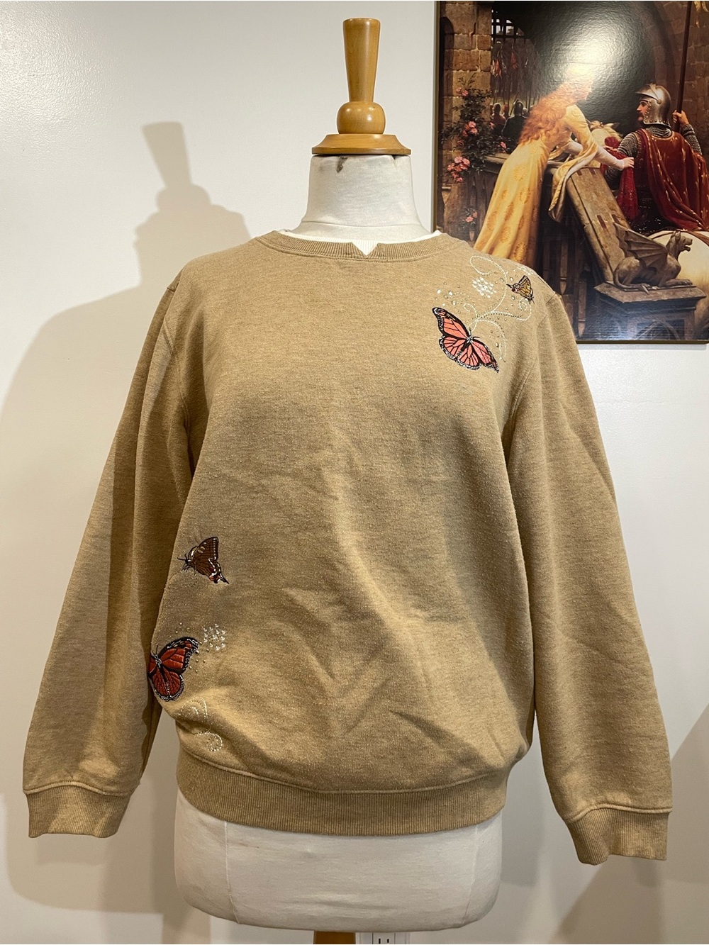 Tan crewneck sweatshirt for fall with embroidered butterfly